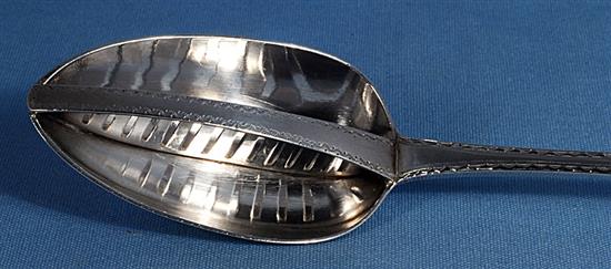 A George III Irish silver strainer spoon, by John Osborne, Length; 315mm Weight: 4.5oz/140 grms